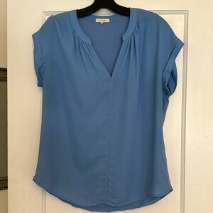 Light blue blouse.